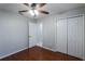 Bedroom features hardwood floors, closet, and access to another room at 1663 Markel Dr. Dr, Winter Garden, FL 34787