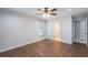 Bedroom with vinyl flooring, ceiling fan, and access to a bathroom at 1663 Markel Dr. Dr, Winter Garden, FL 34787