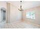 Dining room featuring tile flooring, a chandelier, and a sunlit window providing natural light at 1663 Markel Dr. Dr, Winter Garden, FL 34787
