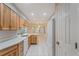 A large kitchen features light wood cabinetry, modern appliances, and a cozy breakfast area at 1663 Markel Dr. Dr, Winter Garden, FL 34787