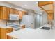 Featuring a breakfast bar, the bright kitchen offers modern appliances and a functional layout at 1663 Markel Dr. Dr, Winter Garden, FL 34787