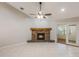 Spacious living room featuring tile flooring, a stone fireplace, and sliding glass doors leading to an enclosed porch at 1663 Markel Dr. Dr, Winter Garden, FL 34787