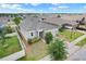 Beautiful home with a manicured lawn, a two car garage, and a brick paver driveway at 169 Jensen Dr, Groveland, FL 34736