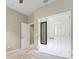 Bedroom showcasing double closets, neutral carpet and trim, and ample space at 169 Jensen Dr, Groveland, FL 34736