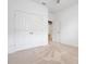 Bedroom showcasing double closets, neutral carpet and trim, and ample space at 169 Jensen Dr, Groveland, FL 34736