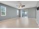 Bright bedroom with large windows, sliding door, and neutral color scheme at 169 Jensen Dr, Groveland, FL 34736