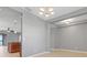 Open dining room area with modern chandelier and easy kitchen access at 169 Jensen Dr, Groveland, FL 34736