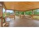 Interior of a gazebo with wooden benches and floors, offering a peaceful retreat and scenic views of the surrounding nature at 169 Jensen Dr, Groveland, FL 34736