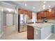 Spacious kitchen with stainless steel appliances and a granite countertop island at 169 Jensen Dr, Groveland, FL 34736