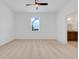 Bright main bedroom with ceiling fan and en suite bathroom access at 169 Jensen Dr, Groveland, FL 34736