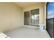 Covered patio with slider access to the interior, offering a relaxing outdoor living space at 169 Jensen Dr, Groveland, FL 34736