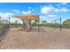 Well-maintained playground with slides, swings, and safety mulch ground cover in a community setting at 169 Jensen Dr, Groveland, FL 34736
