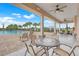 View of the community pool, showcasing the patio furniture, clear water, and palm tree landscaping at 169 Jensen Dr, Groveland, FL 34736