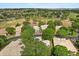 Aerial view of houses and neighborhood with golf course in the distance at 2112 Saint Ives Ct, Clermont, FL 34711