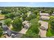Aerial view of neighborhood with mature trees and well-maintained landscaping at 2112 Saint Ives Ct, Clermont, FL 34711