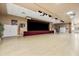 Large auditorium with stage and open floor space, ideal for events, performances, and community activities at 2112 Saint Ives Ct, Clermont, FL 34711