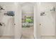 Walk through bedroom closet featuring wire shelving on both sides leading to the bedroom at 2112 Saint Ives Ct, Clermont, FL 34711
