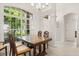 Bright dining area with a large window offering natural light and views of the outdoors at 2112 Saint Ives Ct, Clermont, FL 34711