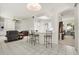 Open-concept kitchen featuring a breakfast bar that overlooks the living area, offering seamless entertaining at 2112 Saint Ives Ct, Clermont, FL 34711