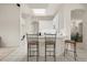 Bright kitchen with a breakfast bar offering open views to adjacent living areas and ample counter space at 2112 Saint Ives Ct, Clermont, FL 34711