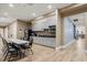 Well-equipped kitchenette features modern appliances, ample counter space, and convenient access to dining area and hallway at 2112 Saint Ives Ct, Clermont, FL 34711