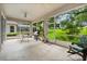 Outdoor patio space including a grill and table at 2112 Saint Ives Ct, Clermont, FL 34711