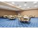 Large meeting room with round tables and chairs, perfect for gatherings and events at 2112 Saint Ives Ct, Clermont, FL 34711