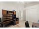 Home office featuring neutral walls, ceiling fan, closet, and a large desk at 2112 Saint Ives Ct, Clermont, FL 34711