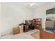 Home office featuring neutral walls, ceiling fan, and a large desk at 2112 Saint Ives Ct, Clermont, FL 34711