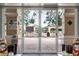 Pool entrance with double doors leading to community pool and sunbathing area, offering a fun and convenient recreation at 2112 Saint Ives Ct, Clermont, FL 34711