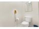 Toilet and telephone inside of a cozy bathroom at 2112 Saint Ives Ct, Clermont, FL 34711