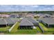 Community aerial showing fenced backyards, and a shared fence line, with well-manicured lawns in a desirable location at 2129 Landrea Loop, The Villages, FL 32163