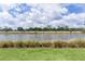 Amazing water view of a serene lake with a well manicured backyard at 2129 Landrea Loop, The Villages, FL 32163