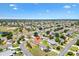 Expansive aerial view of residential neighborhood with golf course and water features at 2167 Kerwood Loop, The Villages, FL 32162