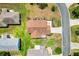 Aerial view of the home showcasing the roof, landscaping, and surrounding neighborhood at 2167 Kerwood Loop, The Villages, FL 32162