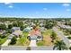 Aerial view of home in a neighborhood setting, landscaped front yard, sunny sky above at 2167 Kerwood Loop, The Villages, FL 32162