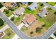 Aerial view of home and neighborhood, showing mature trees and nearby houses at 2167 Kerwood Loop, The Villages, FL 32162