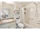 Functional bathroom featuring a tub with shower, a white shower curtain, and a vanity with a mirror at 2167 Kerwood Loop, The Villages, FL 32162