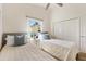 Charming bedroom with two beds, neutral decor, a ceiling fan, and a closet for ample storage at 2167 Kerwood Loop, The Villages, FL 32162