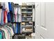Organized walk-in closet with shelving, hanging racks, and ample storage space at 2167 Kerwood Loop, The Villages, FL 32162