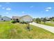 Charming single-Gathering home featuring a well-maintained lawn and an attached two-car garage at 2167 Kerwood Loop, The Villages, FL 32162