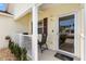 Cozy front porch with seating, offering a welcoming entrance to this charming home at 2167 Kerwood Loop, The Villages, FL 32162
