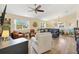 Bright and airy living area with hardwood floors, stylish furnishings, and plenty of natural light at 2167 Kerwood Loop, The Villages, FL 32162