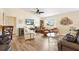 Relaxing living room with comfortable seating, a ceiling fan, and plenty of natural light at 2167 Kerwood Loop, The Villages, FL 32162