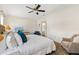 Spacious bedroom with bright natural light, ceiling fan, and neutral decor at 2167 Kerwood Loop, The Villages, FL 32162