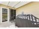 Cozy patio with outdoor seating, a grill, and a covered pergola for relaxing and entertaining at 2167 Kerwood Loop, The Villages, FL 32162