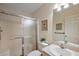 Bright bathroom featuring a shower with glass doors and a well-lit vanity area at 2296 Whisper St, The Villages, FL 32162