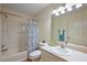 Bathroom with shower and tub combo, sink, mirror and vanity with great lighting at 2296 Whisper St, The Villages, FL 32162