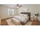 Bedroom featuring a comfortable bed, neutral walls and a window bringing in natural light at 2296 Whisper St, The Villages, FL 32162