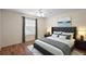 Comfortable bedroom with a plush bed, neutral walls and a window offering natural light at 2296 Whisper St, The Villages, FL 32162